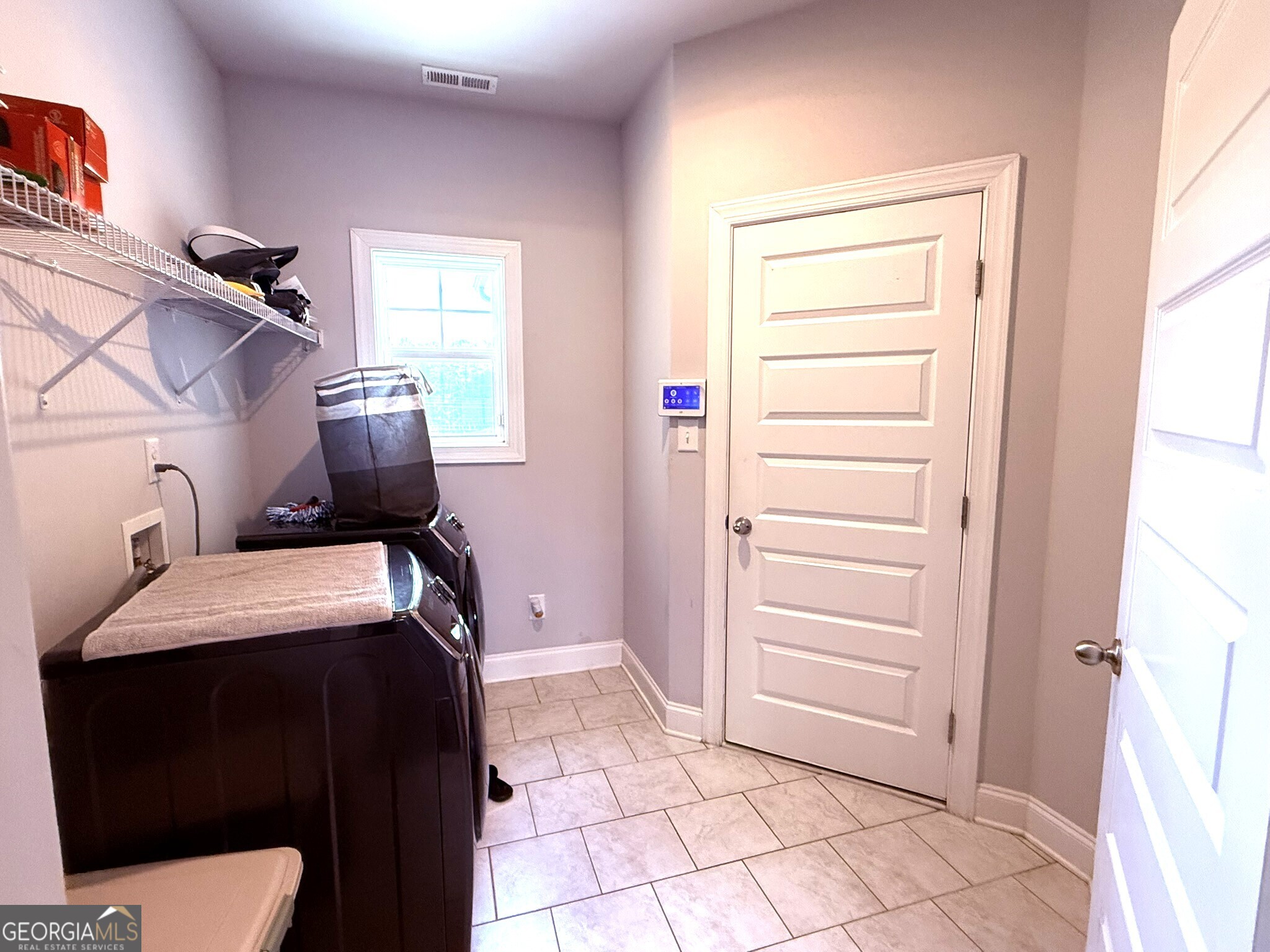 941 Highway 16 Newnan, GA 30263 - Photo 21 of 43 a room with storage and utility