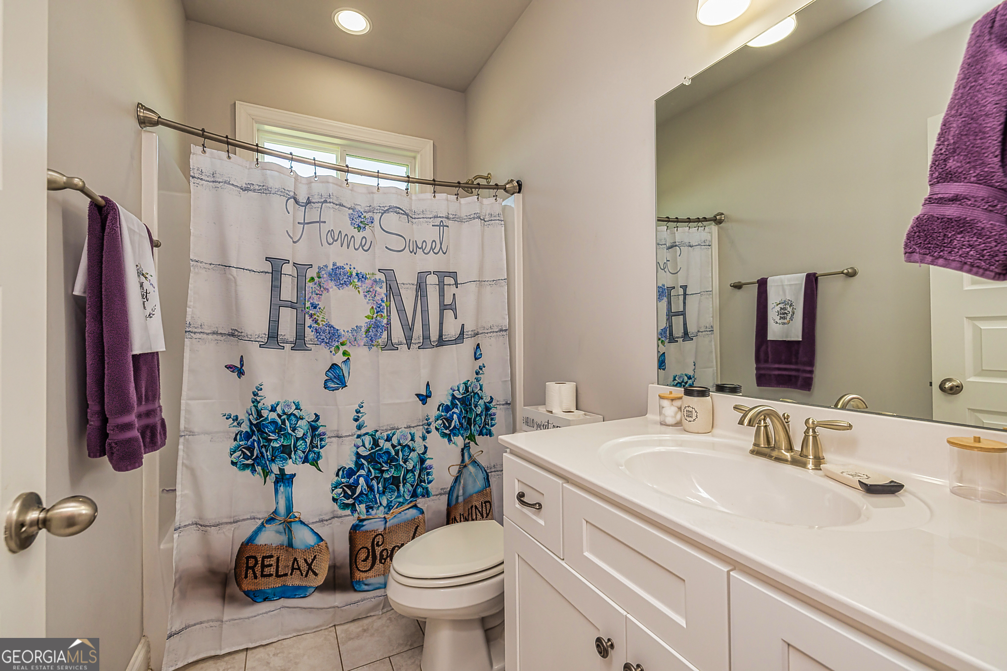 941 Highway 16 Newnan, GA 30263 - Photo 23 of 43 a bathroom with a sink toilet and shower