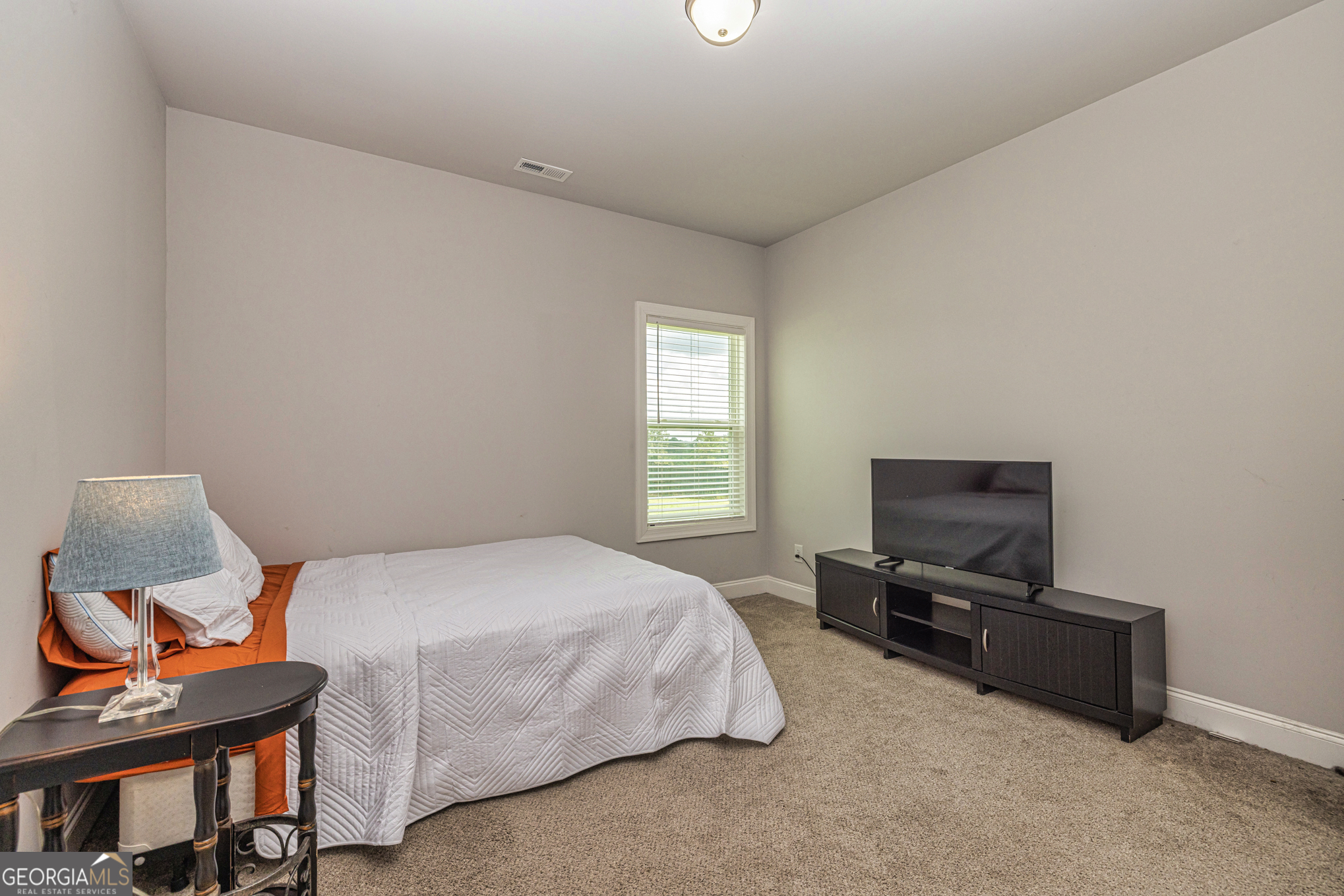 941 Highway 16 Newnan, GA 30263 - Photo 24 of 43 a bedroom with a bed and tv