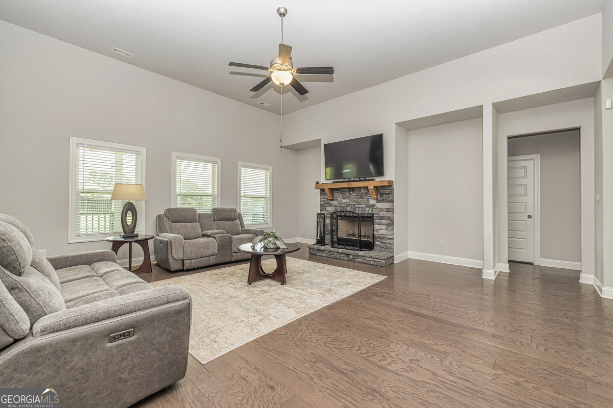 941 Highway 16 Newnan, GA 30263 - Photo 5 of 43 a living room with furniture and a fireplace