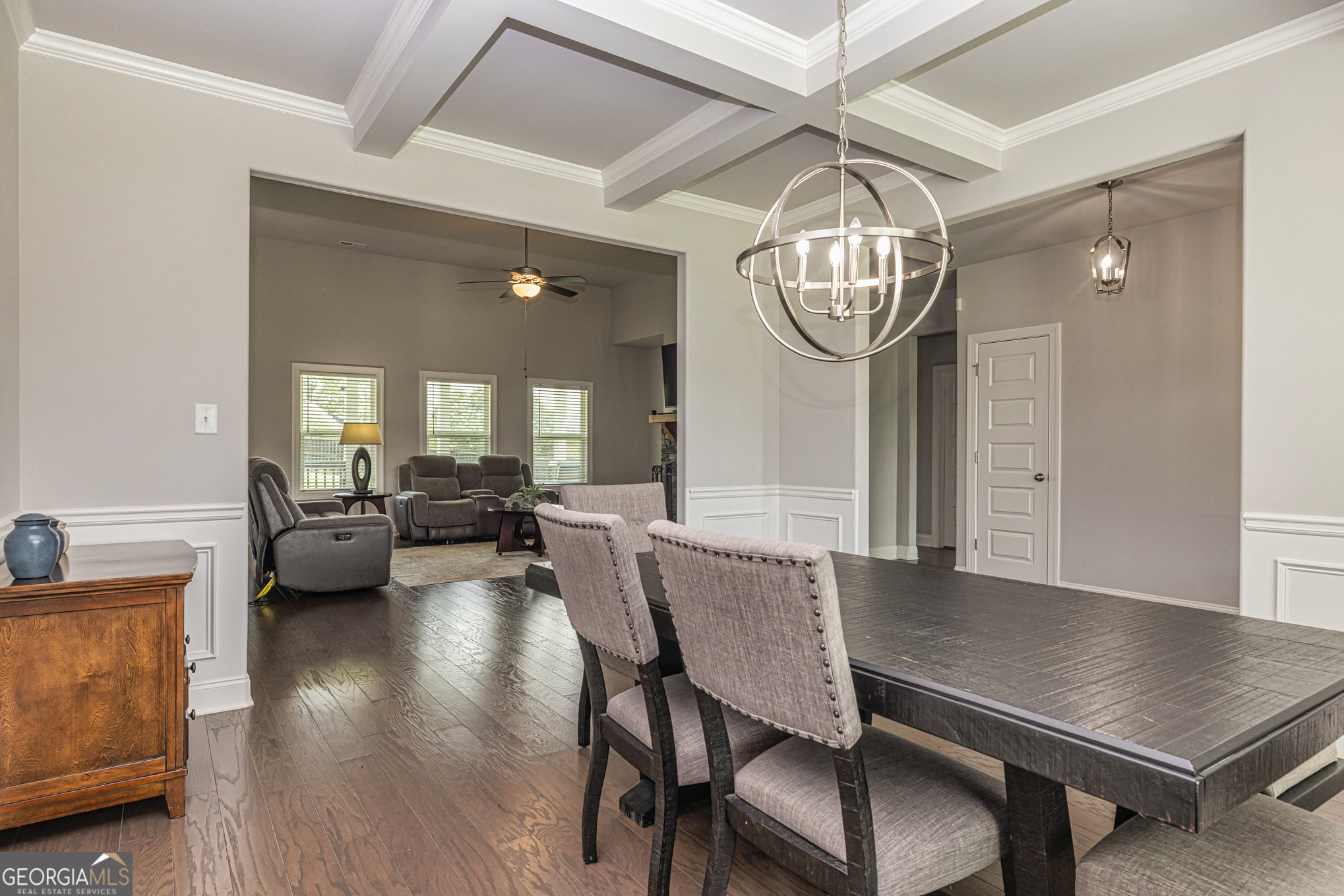 941 Highway 16 Newnan, GA 30263 - Photo 9 of 43 a view of a dining room with furniture a chandelier and wooden floor