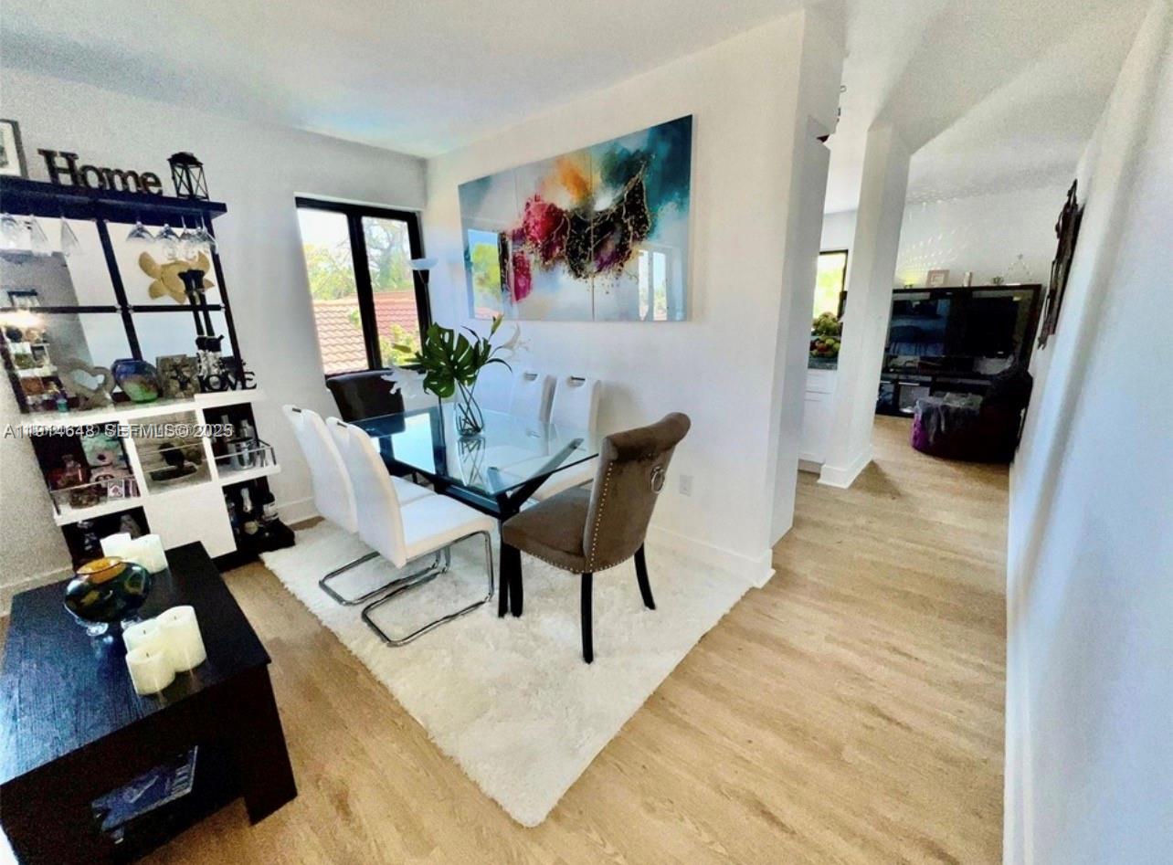 3520 Southwest 25th Street Miami, FL 33133 - Photo 10 of 43 a living room with furniture and a flat screen tv