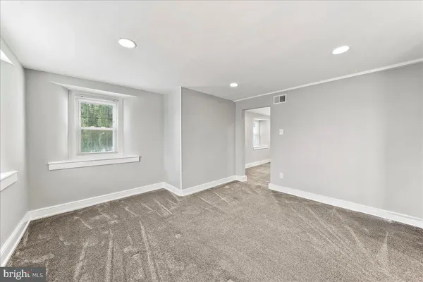 a picture of a bench in a bathroom