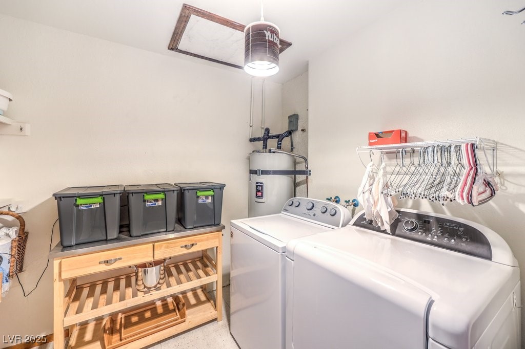 10615 Rancho Destino Road Las Vegas, NV 89183 - Photo 34 of 53 Clothes washing area featuring separate washer and dryer, secured water heater, and laundry area