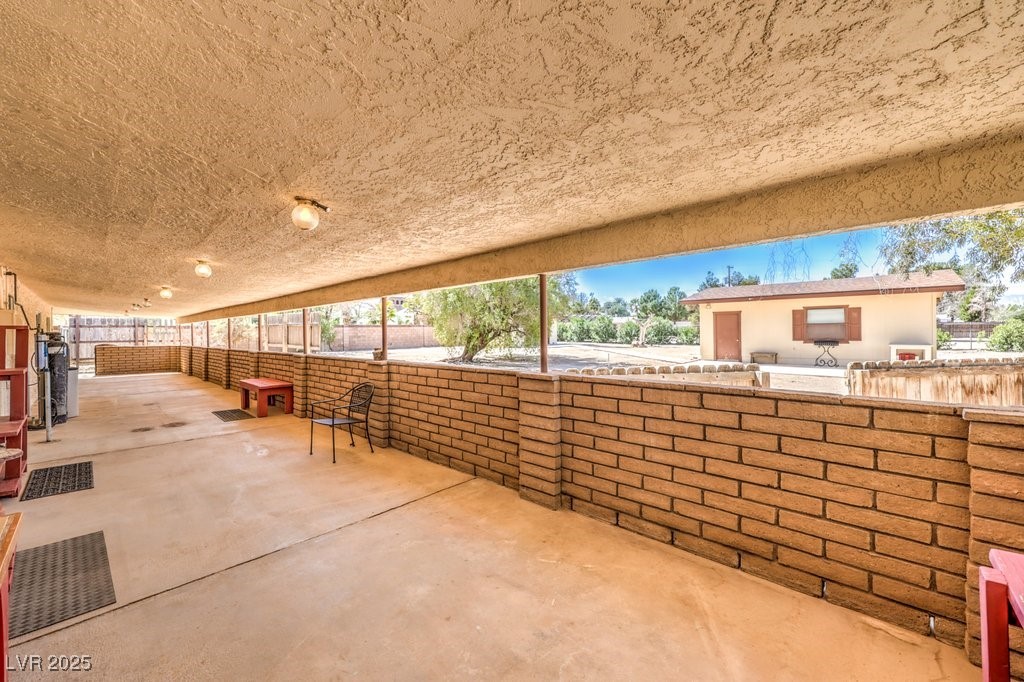 10615 Rancho Destino Road Las Vegas, NV 89183 - Photo 35 of 53 View of patio / terrace featuring fence