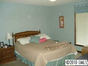 9800 Surrey Road Charlotte, NC 28227 - Photo 5 of 8 a bedroom with a bed and a window