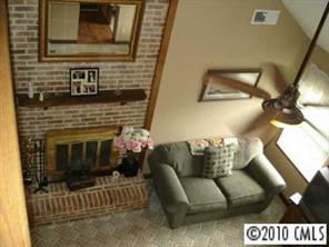9800 Surrey Road Charlotte, NC 28227 - Photo 7 of 8 a living room with furniture and a fireplace