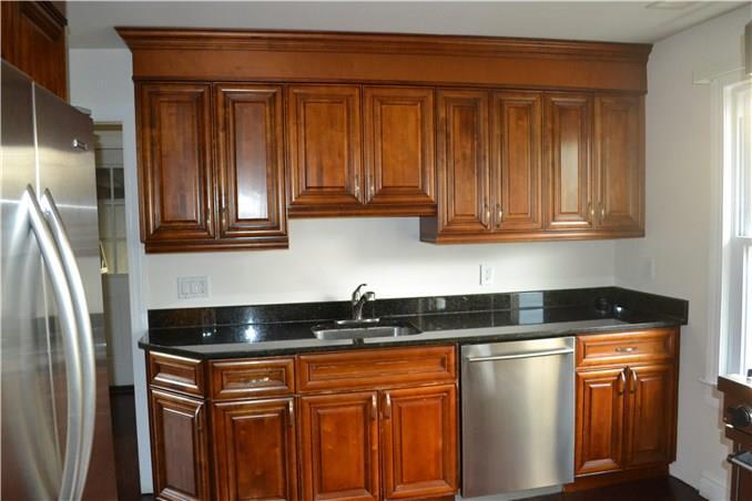 264 Reef Road Fairfield, CT 06824 - Photo 1 of 1 a kitchen with stainless steel appliances granite countertop a refrigerator and a sink
