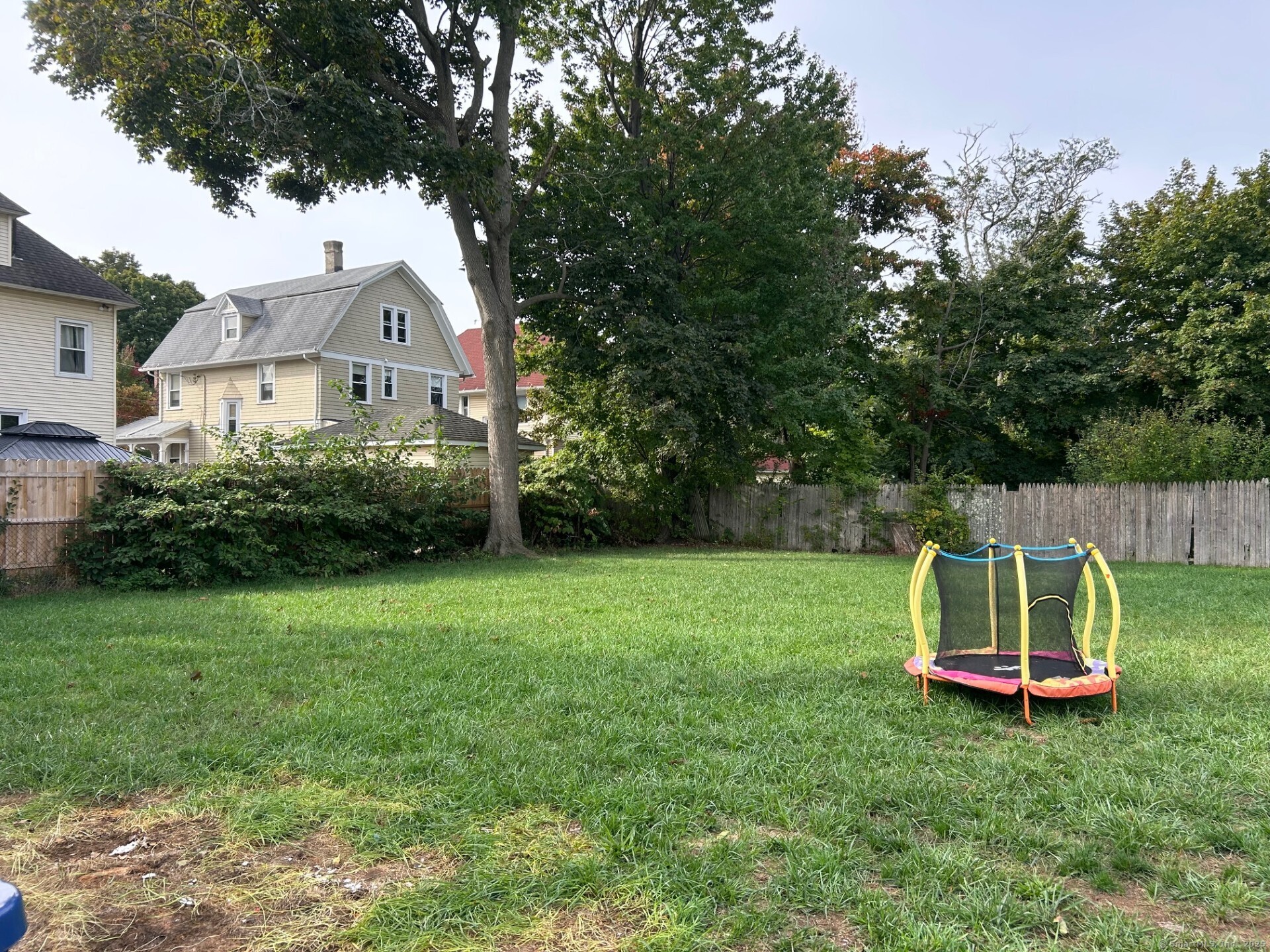 592 3rd Avenue West Haven, CT 06516 - Photo 14 of 14 a view of a backyard with a garden and entertaining space