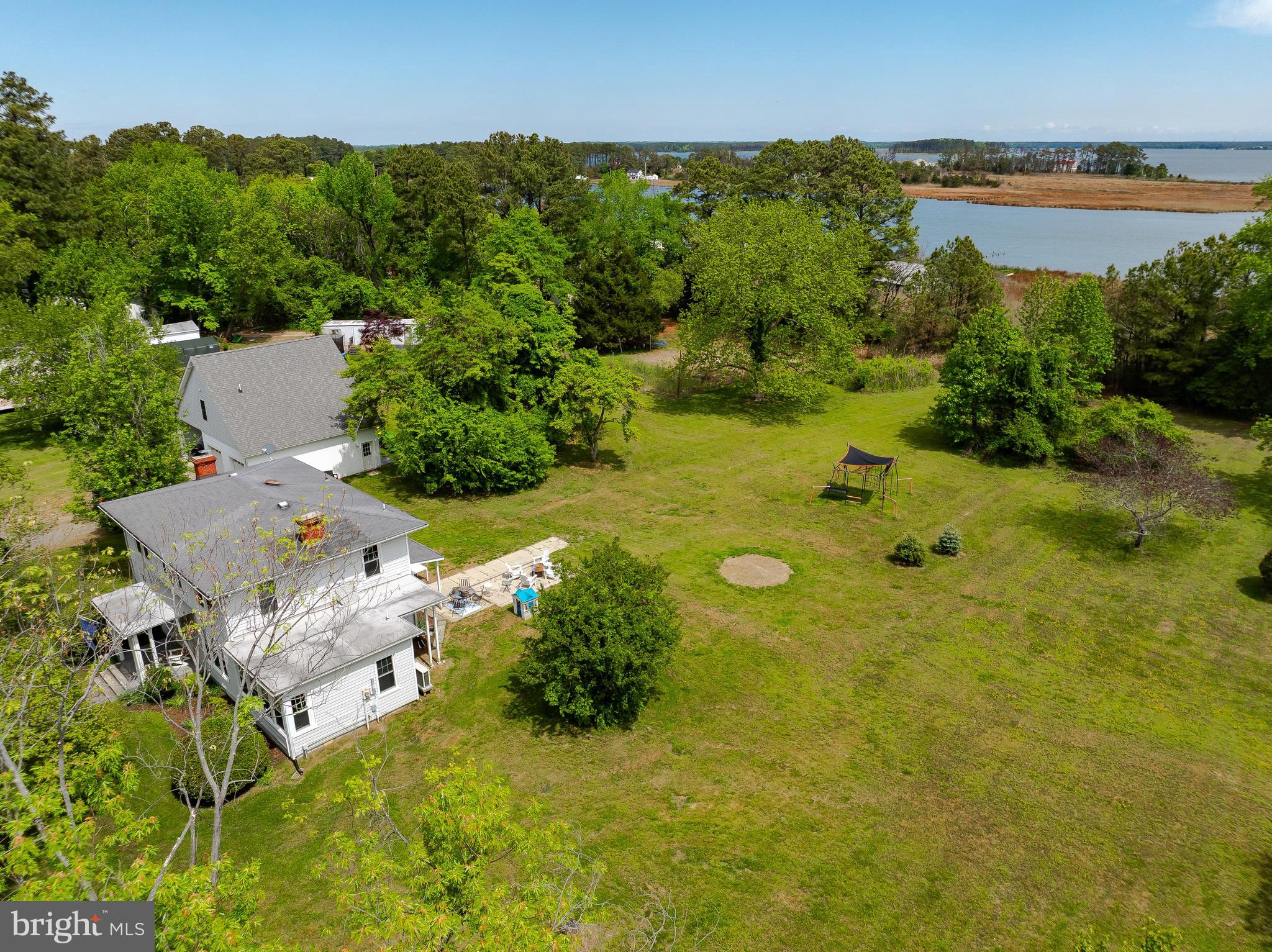 16146 Thomas Road Piney Point, MD 20674 - Photo 47 of 57 an aerial view of a residential houses with yard and lake view