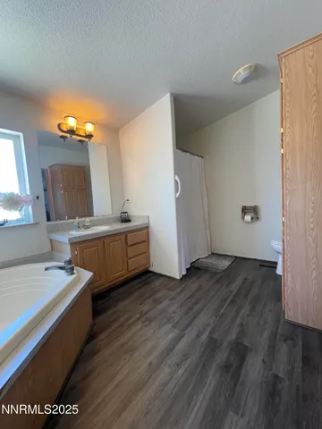 a view of a room with wooden floor and window