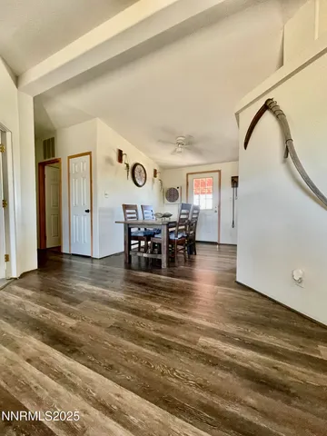 a view of a livingroom with dining room and furniture