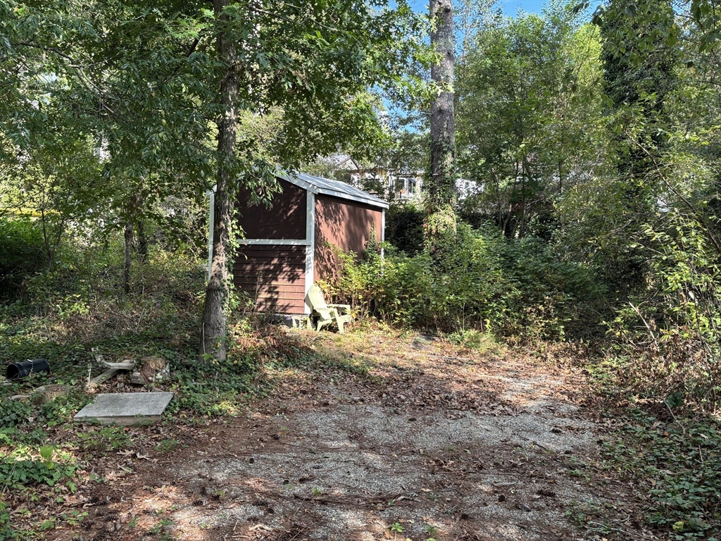 119 Lake Avenue Wareham, MA 02538 - Photo 4 of 11 a backyard of a house with lots of green space