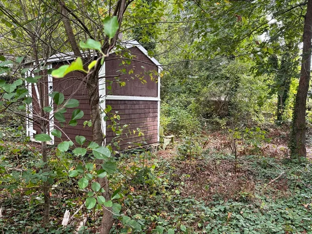a aerial view of a house with a yard