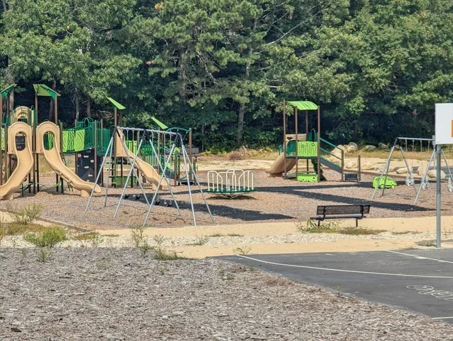 a view of a lake with houses in the back