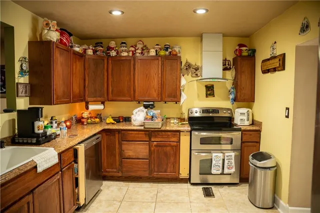 a kitchen with a sink appliances and cabinets