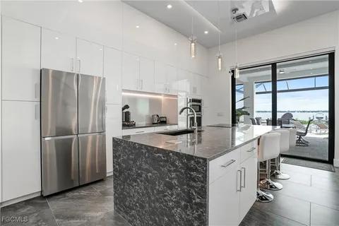 a living room with furniture a potted plant and a table