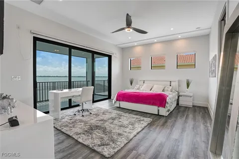 a bathroom with a granite countertop sink a mirror and shower