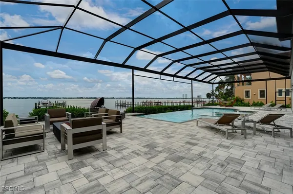 a view of swimming pool with outdoor seating