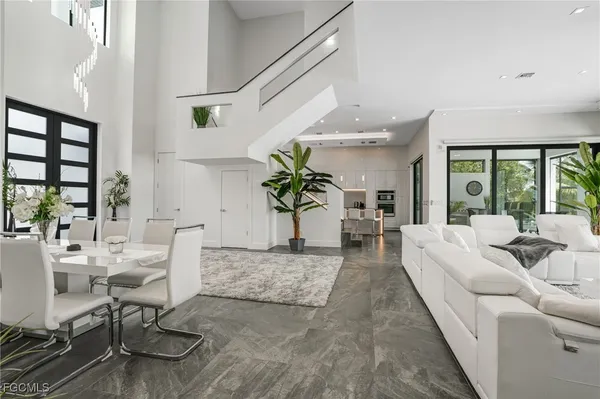 a dining room with furniture and wooden floor