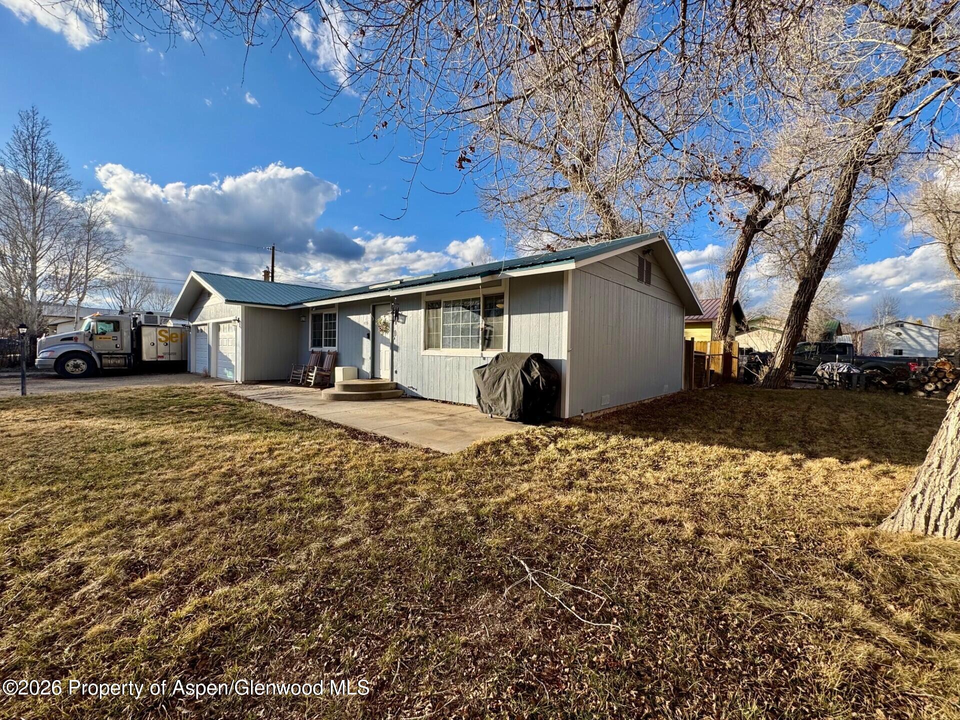 495 East 11th Street Craig, CO 81625 - Photo 11 of 12 a view of a house with a yard