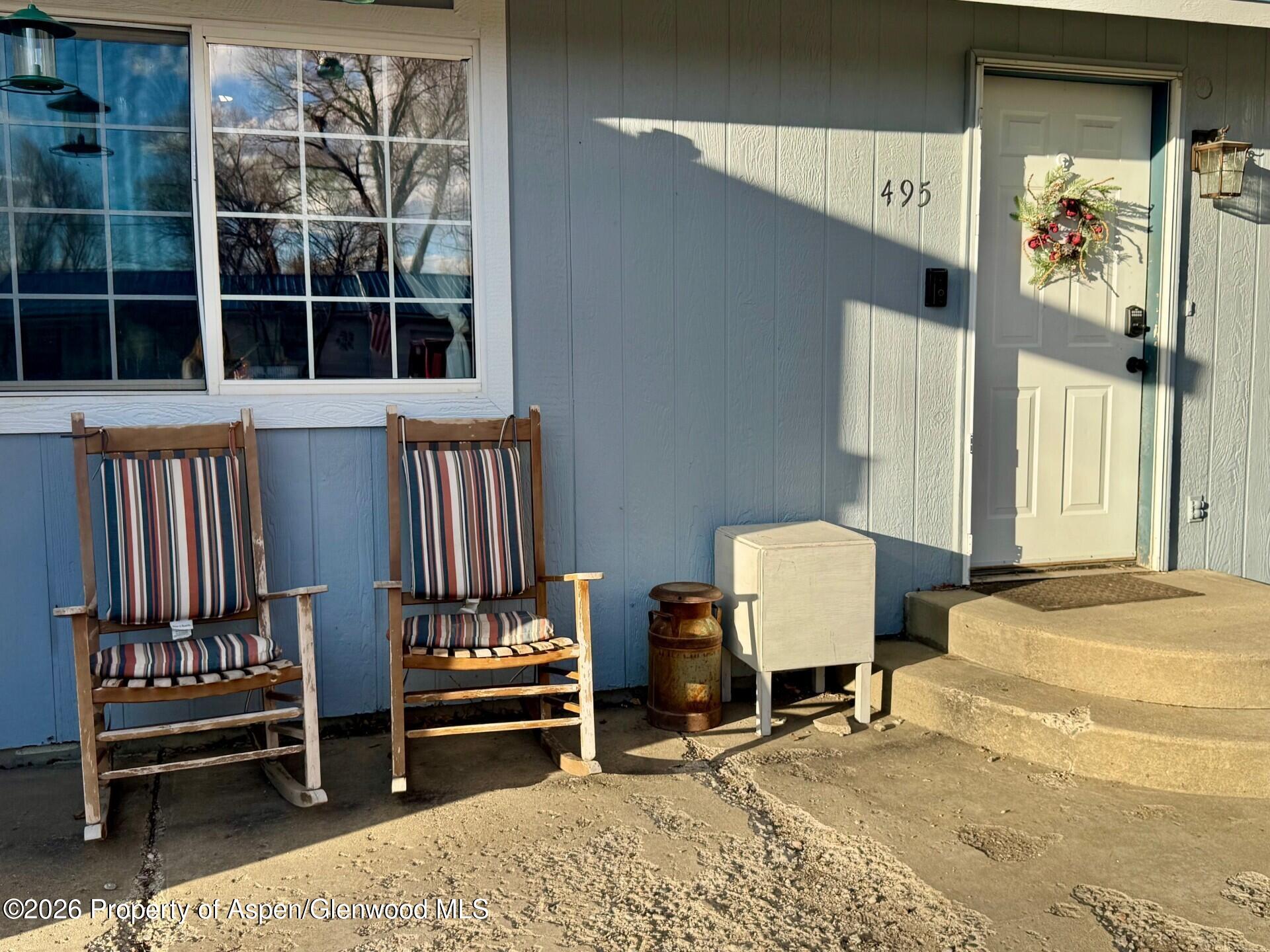 495 East 11th Street Craig, CO 81625 - Photo 2 of 12 a view of a livingroom with furniture and windows