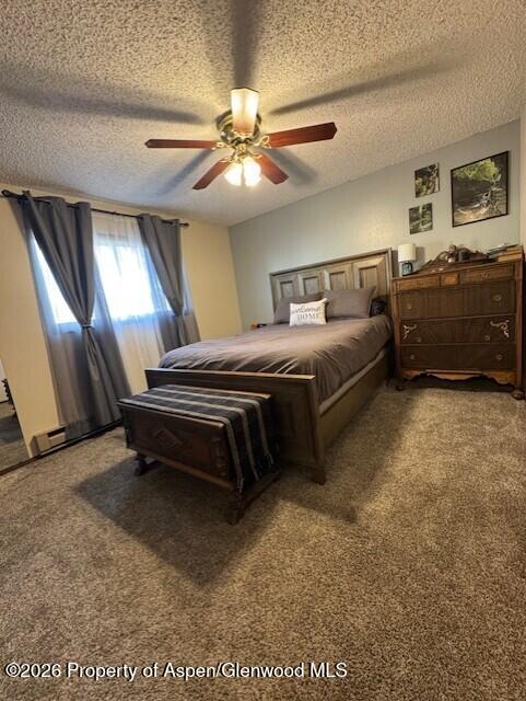 495 East 11th Street Craig, CO 81625 - Photo 7 of 12 a bedroom with a bed and ceiling fan