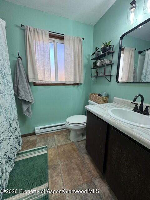 495 East 11th Street Craig, CO 81625 - Photo 8 of 12 a bathroom with a sink a toilet and mirror