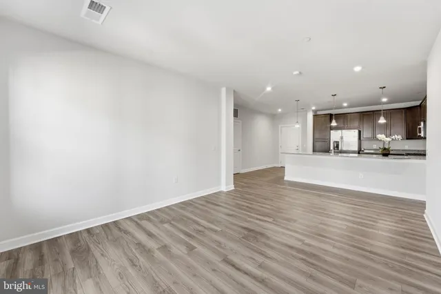 a view of kitchen and kitchen with a sink