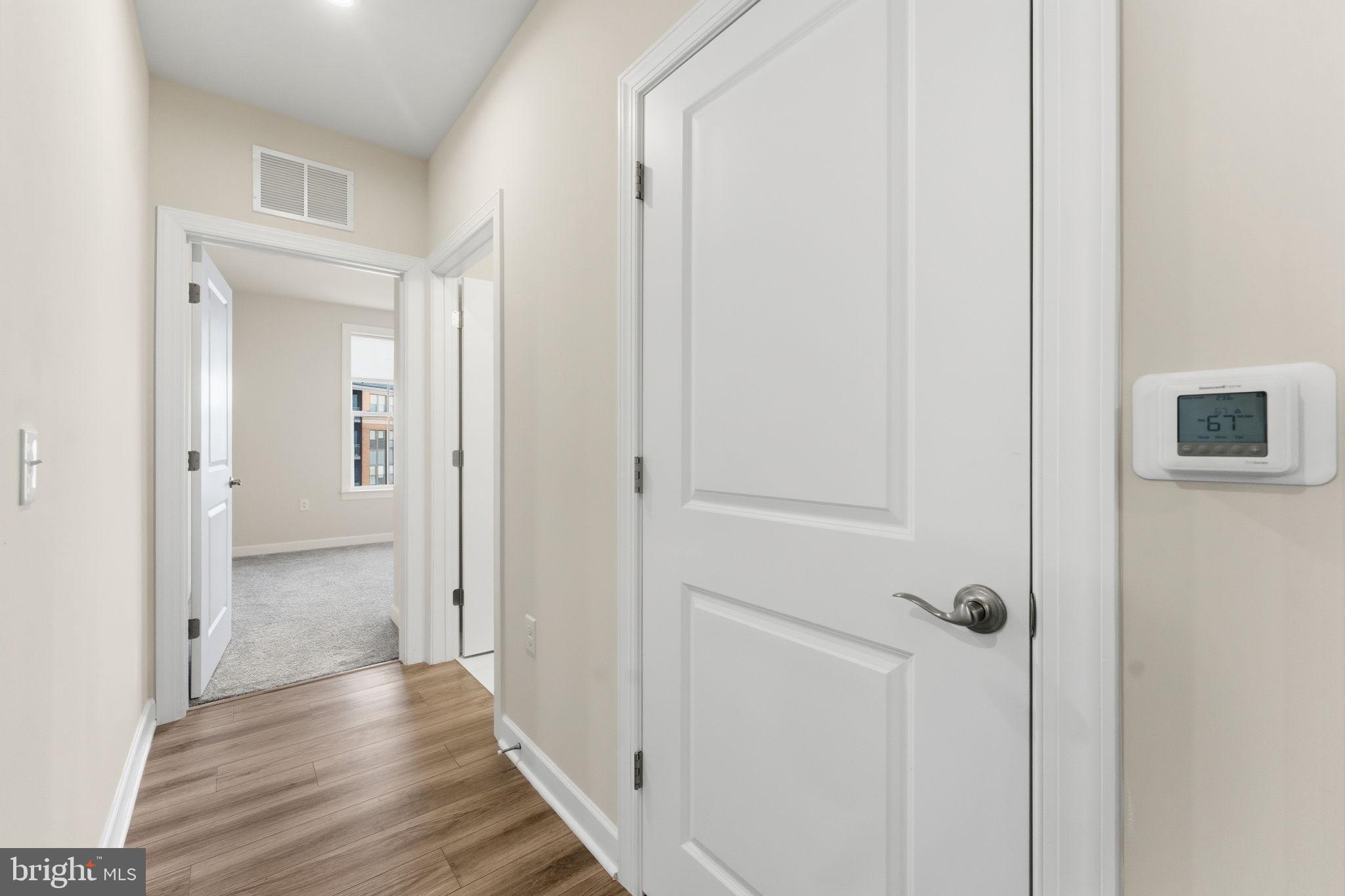 3925 Fair Ridge Drive, Unit 304 Fairfax, VA 22033 - Photo 17 of 44 a view of a hallway with wooden floor