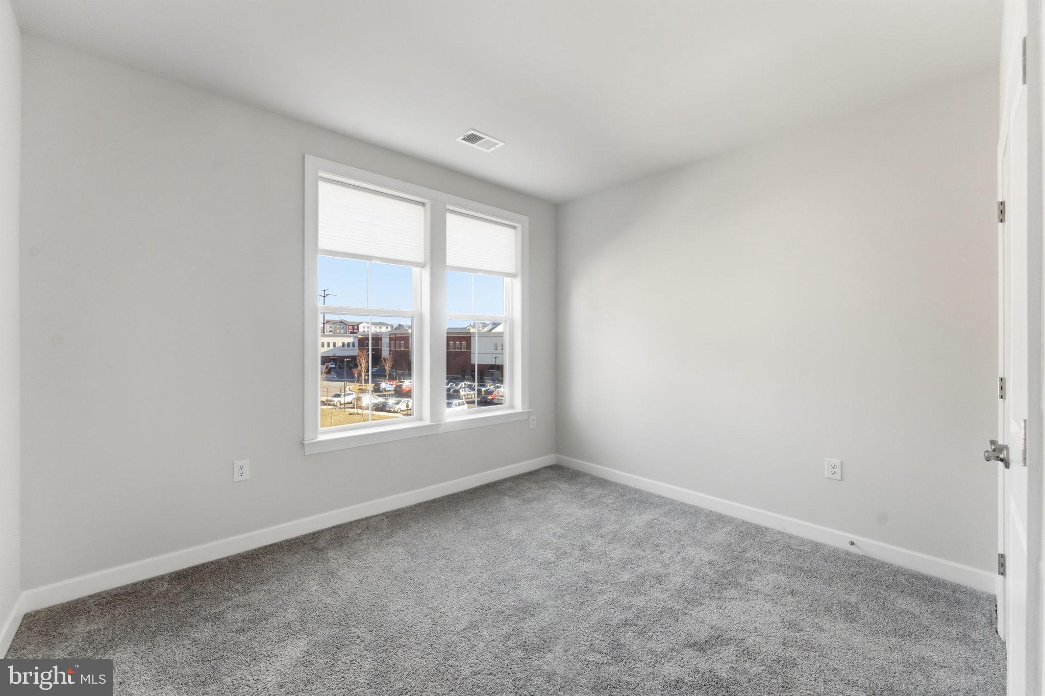3925 Fair Ridge Drive, Unit 304 Fairfax, VA 22033 - Photo 18 of 44 an empty room with a window