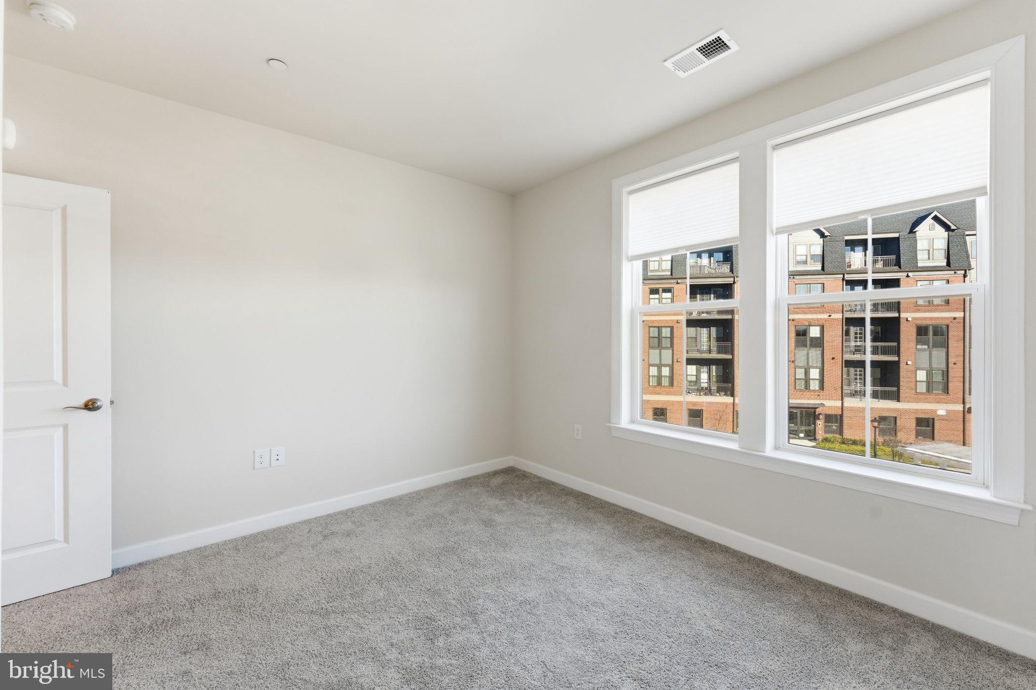 3925 Fair Ridge Drive, Unit 304 Fairfax, VA 22033 - Photo 21 of 44 a view of an empty room with a window