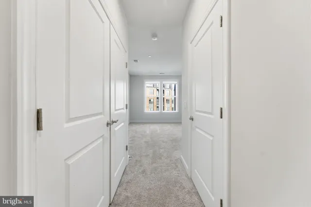 a view of a hallway with a white walls