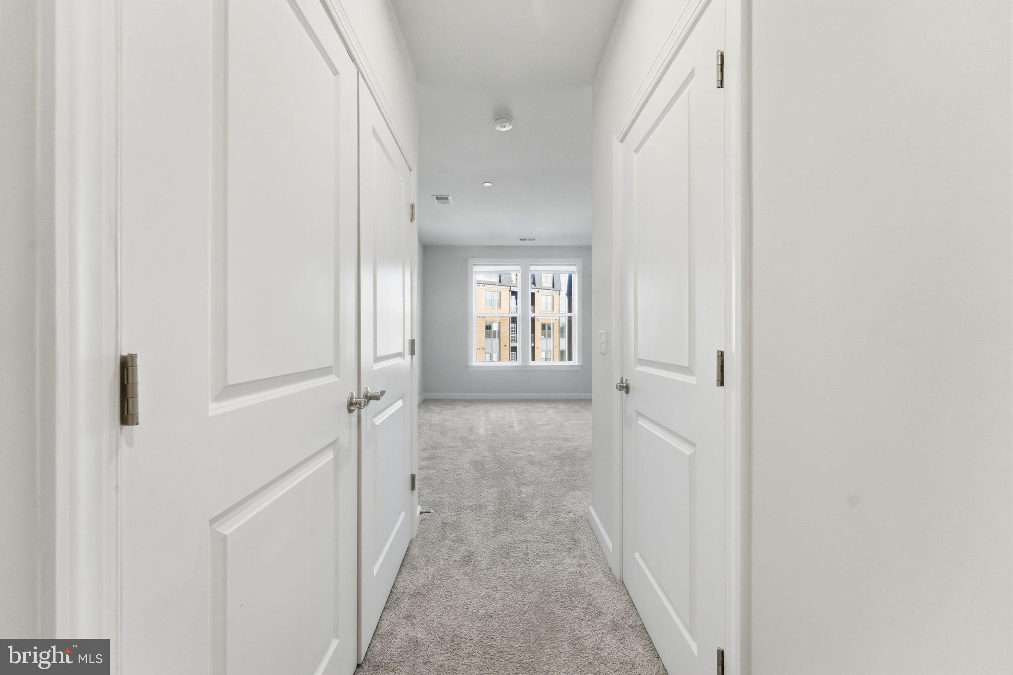 3925 Fair Ridge Drive, Unit 304 Fairfax, VA 22033 - Photo 24 of 44 a view of a hallway with a white walls