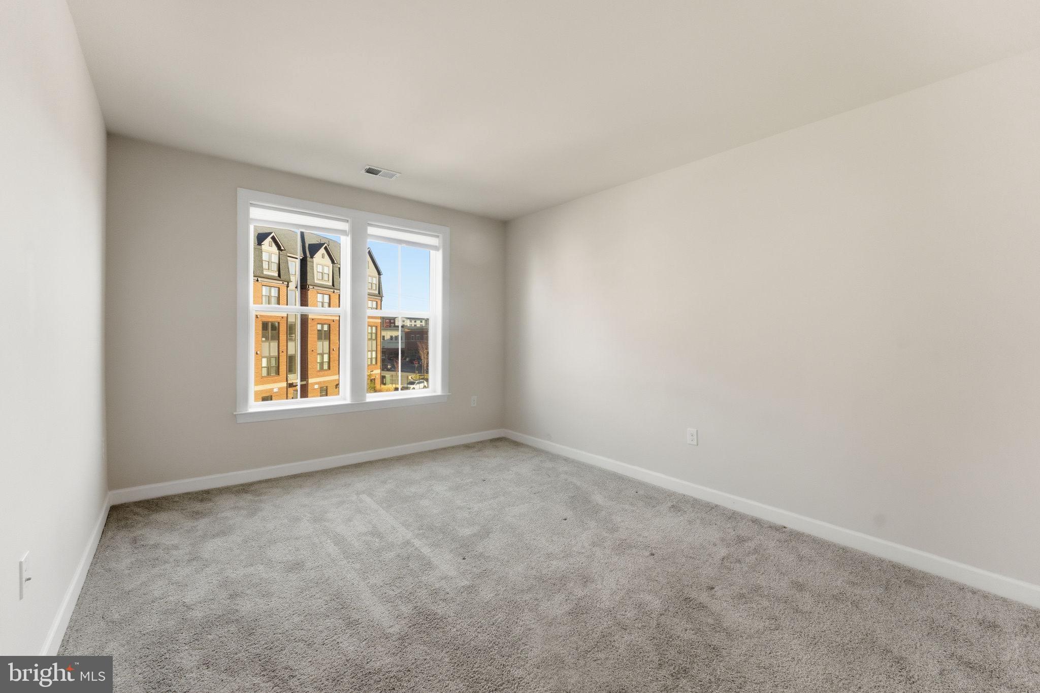 3925 Fair Ridge Drive, Unit 304 Fairfax, VA 22033 - Photo 27 of 44 an empty room with a window