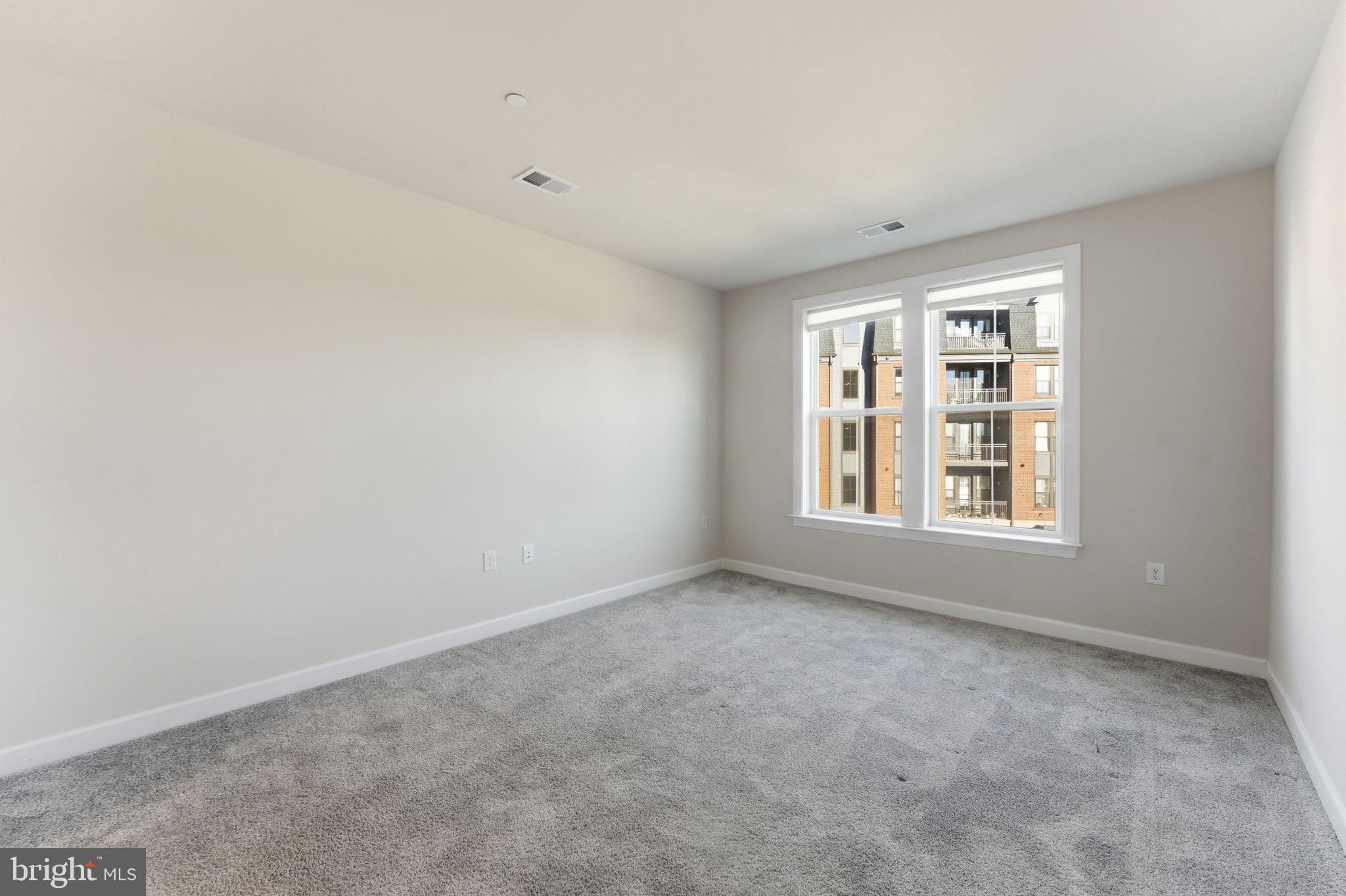 3925 Fair Ridge Drive, Unit 304 Fairfax, VA 22033 - Photo 28 of 44 an empty room with windows
