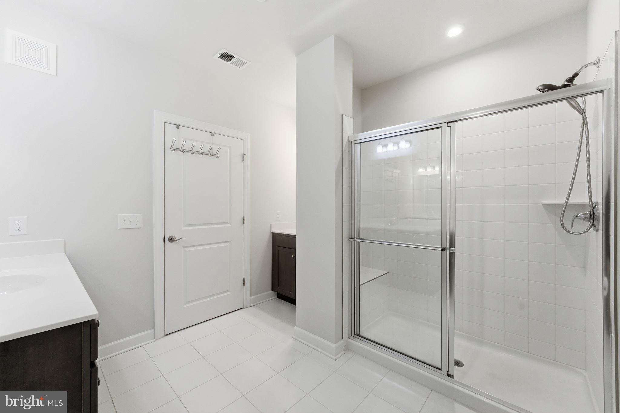 3925 Fair Ridge Drive, Unit 304 Fairfax, VA 22033 - Photo 32 of 44 a bathroom with a shower
