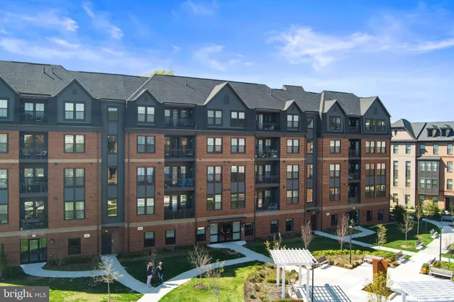 a front view of a house with swimming pool and porch