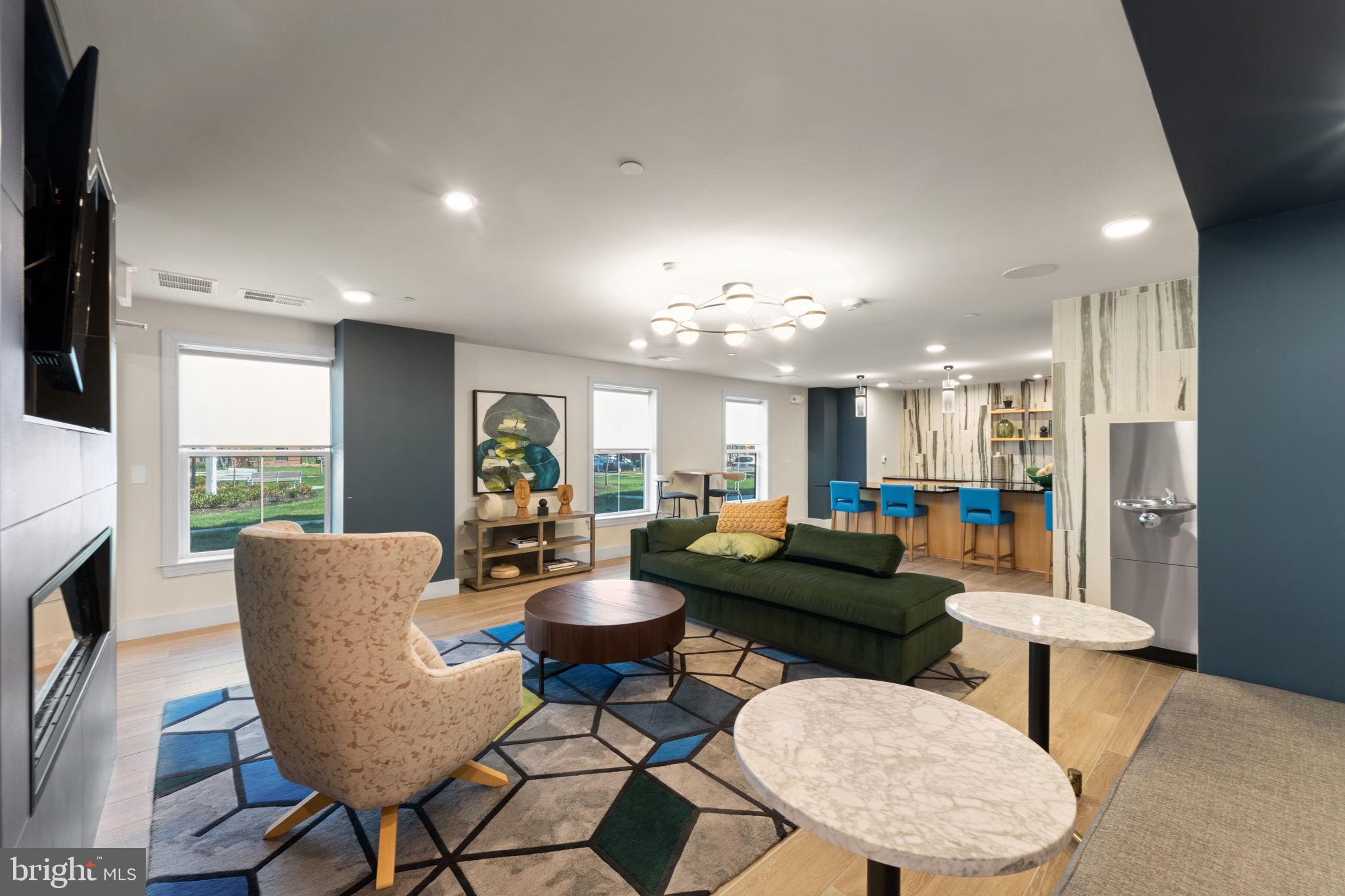 3925 Fair Ridge Drive, Unit 304 Fairfax, VA 22033 - Photo 43 of 44 a living room with furniture kitchen view and a large window