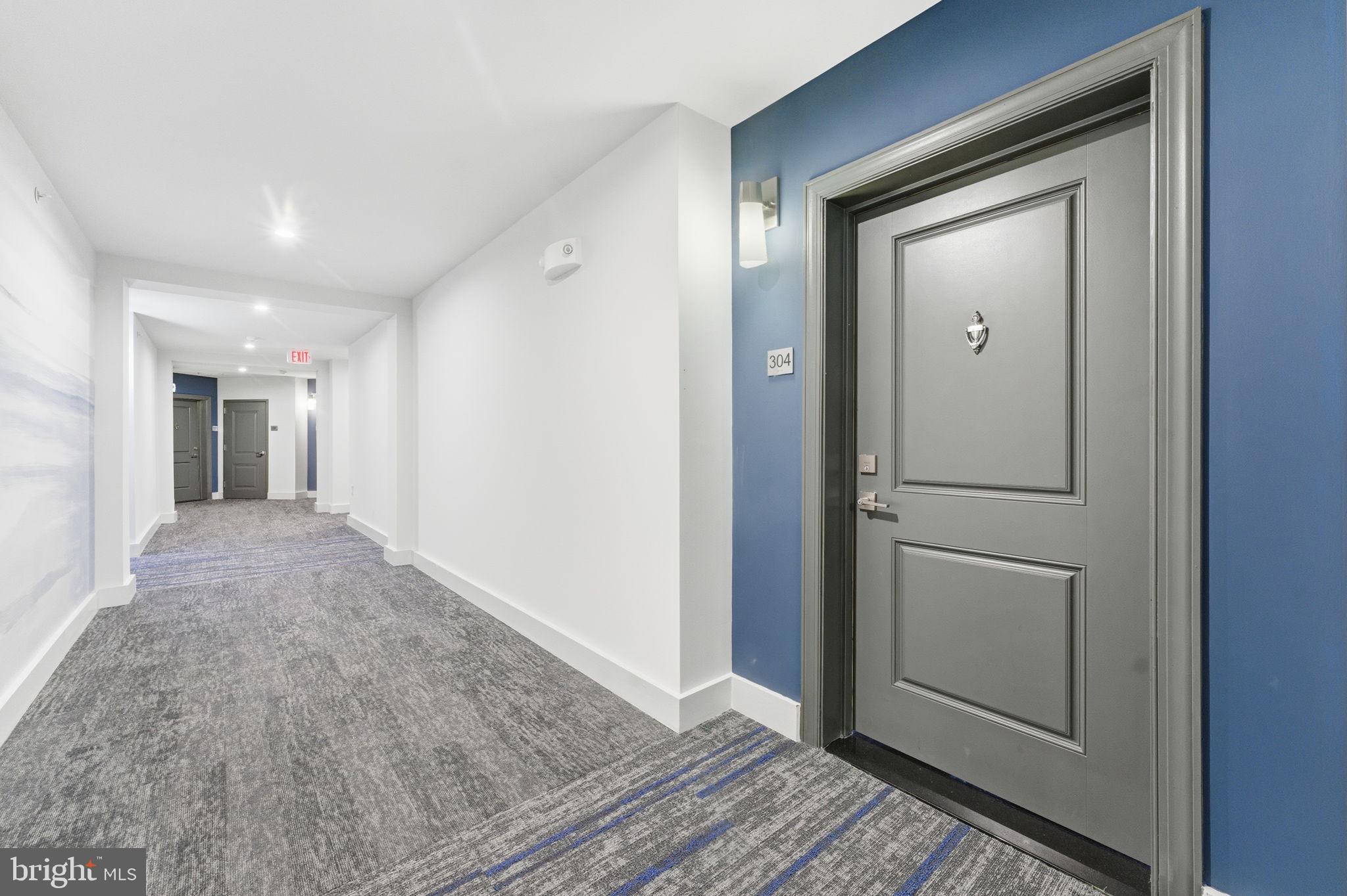 3925 Fair Ridge Drive, Unit 304 Fairfax, VA 22033 - Photo 5 of 44 a view of a hallway with wooden floor