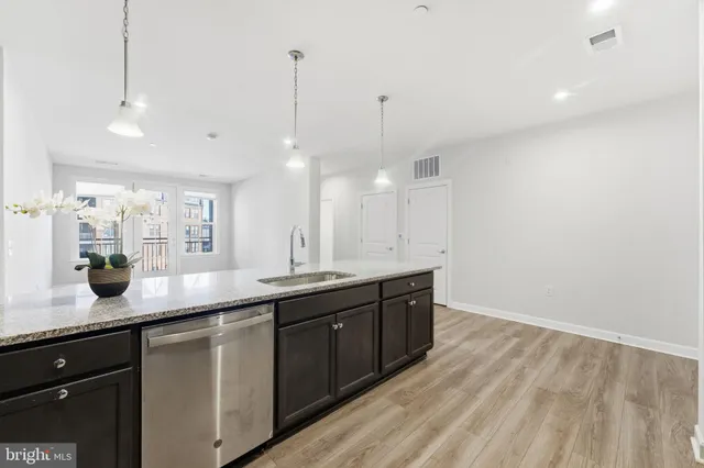 a kitchen with sink and cabinets