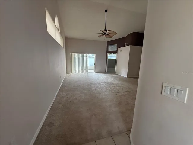 a view of a hallway with a chandelier