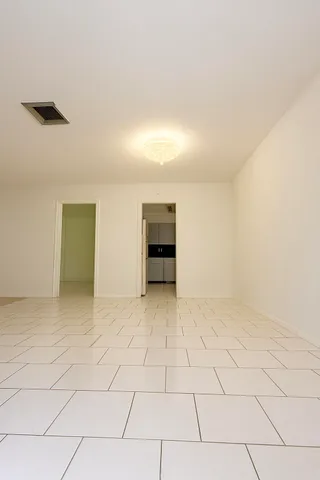 a bathroom with a double vanity sink mirror and toilet