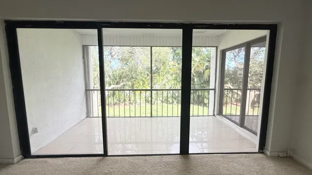a view of an empty room with a balcony