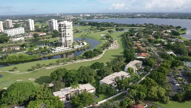 an aerial view of a residential houses with outdoor space