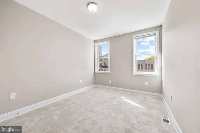 an empty room with windows