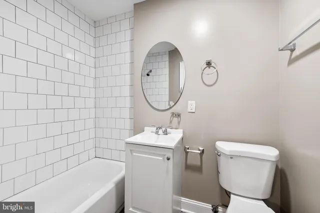 a bathroom with a sink toilet and a bathtub