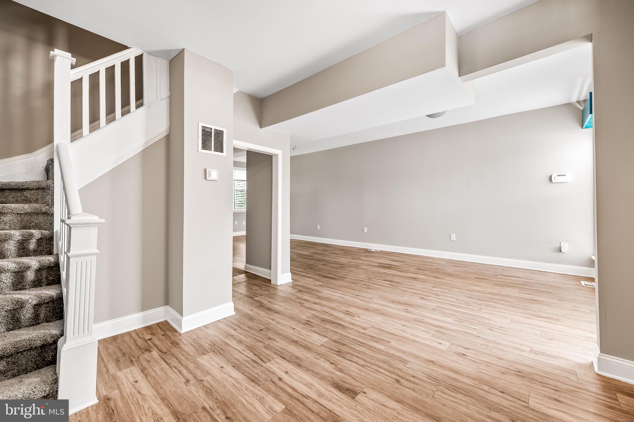4021 Park Heights Avenue Baltimore, MD 21215 - Photo 6 of 32 a view of an empty room with wooden floor
