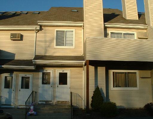 136 Pembroke Road, Unit 68 Danbury, CT 06811 - Photo 1 of 1 a view of a house with a balcony