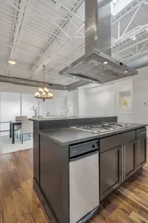 a kitchen with a stove and a table